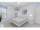 Cozy bedroom featuring a comfortable bed, side tables with lamps, and soft gray carpeting at 481 Morning Glory Ct., Myrtle Beach, SC 29579