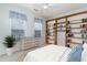 Comfortable bedroom featuring a bookshelf, a large window, and plenty of natural light at 481 Morning Glory Ct., Myrtle Beach, SC 29579