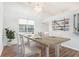 Inviting dining area with modern decor, a decorative oar display, and a large window at 481 Morning Glory Ct., Myrtle Beach, SC 29579