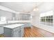 Stylish kitchen with gray cabinetry, an island, modern countertops, and natural light at 481 Morning Glory Ct., Myrtle Beach, SC 29579