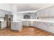 Well-appointed kitchen features stainless steel appliances, an island, and elegant gray cabinetry at 481 Morning Glory Ct., Myrtle Beach, SC 29579