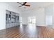 Spacious open living area with hardwood flooring, built-in shelving, and plenty of natural light at 481 Morning Glory Ct., Myrtle Beach, SC 29579
