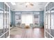 Cozy living area with large windows, modern furnishings, and light blue walls at 481 Morning Glory Ct., Myrtle Beach, SC 29579