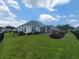 Expansive backyard showcasing a screened porch, well-manicured lawn, and meticulous landscaping at 5318 Tremiti Ln., Myrtle Beach, SC 29579