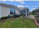 Beautiful backyard with manicured lawn, colorful hydrangeas, and a screened-in porch for outdoor relaxation at 5318 Tremiti Ln., Myrtle Beach, SC 29579