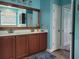 Bathroom with double sink vanity and a decorative framed mirror at 5318 Tremiti Ln., Myrtle Beach, SC 29579