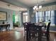 Dining room showcasing hardwood floors, a modern chandelier, and open layout at 5318 Tremiti Ln., Myrtle Beach, SC 29579