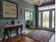 Bright foyer featuring hardwood floors, a decorative rug, and a stylish entryway table at 5318 Tremiti Ln., Myrtle Beach, SC 29579