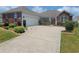 Charming single-story home with brick accents, manicured landscaping, and a wide driveway at 5318 Tremiti Ln., Myrtle Beach, SC 29579