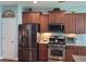 Kitchen featuring stainless steel appliances, granite countertops, tile backsplash, and plenty of storage at 5318 Tremiti Ln., Myrtle Beach, SC 29579