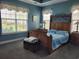 Well-lit main bedroom with large windows and decorative curtains at 5318 Tremiti Ln., Myrtle Beach, SC 29579
