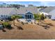 Aerial view of the backyard, patio, and well-manicured landscaping at 533 Canborough Lane, Murrells Inlet, SC 29576