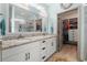 Elegant bathroom with dual sinks, granite countertops, and a spacious walk-in closet at 533 Canborough Lane, Murrells Inlet, SC 29576