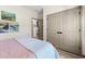 Bedroom featuring gray paneled doors, a peek into another room and nice artwork at 533 Canborough Lane, Murrells Inlet, SC 29576