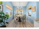 Charming dining area bathed in natural light, showcasing stylish lighting and tranquil views at 533 Canborough Lane, Murrells Inlet, SC 29576