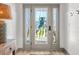 Elegant gray front door with sidelights featuring a unique bird design at 533 Canborough Lane, Murrells Inlet, SC 29576