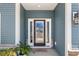 Elegant front door with sidelights and decorative glass at 533 Canborough Lane, Murrells Inlet, SC 29576