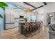Open concept kitchen with a large island, seating, and modern appliances at 533 Canborough Lane, Murrells Inlet, SC 29576