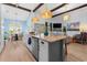 Bright, open kitchen boasts granite countertops, pendant lighting, and a seamless flow into the dining and living areas at 533 Canborough Lane, Murrells Inlet, SC 29576