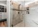 Modern bathroom featuring a glass door shower with decorative tile and built-in shelving at 533 Canborough Lane, Murrells Inlet, SC 29576