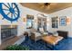 Coastal themed sunroom with blue tiled floor and fireplace at 533 Canborough Lane, Murrells Inlet, SC 29576