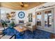 Bright sunroom featuring a fireplace, wood-look ceiling, and coastal decor at 533 Canborough Lane, Murrells Inlet, SC 29576