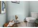 Cozy powder room features tile floors and vintage toilet paper holder at 533 Canborough Lane, Murrells Inlet, SC 29576
