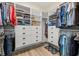 Spacious walk-in closet with custom shelving, drawers, and ample storage space for clothing at 533 Canborough Lane, Murrells Inlet, SC 29576
