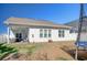 Spacious backyard with a covered patio, furniture, and trampoline at 568 Canborough Lane, Murrells Inlet, SC 29576