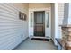 Close-up of the front door featuring sidelights, stylish hardware, and a welcoming entrance at 568 Canborough Lane, Murrells Inlet, SC 29576