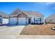 Charming single-Gathering home with a two-car garage and well-maintained front yard on a sunny day at 568 Canborough Lane, Murrells Inlet, SC 29576