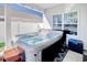 Relaxing hot tub on a covered patio with outdoor furniture at 568 Canborough Lane, Murrells Inlet, SC 29576