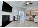 Open-concept living room with fireplace, built-in shelves, and seamless access to dining area at 568 Canborough Lane, Murrells Inlet, SC 29576