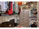 Organized walk-in closet with shelves, hanging rods, and drawers for efficient storage and personal items at 568 Canborough Lane, Murrells Inlet, SC 29576