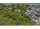 Expansive aerial view of a coastal community with lush trees and homes near the ocean at 6001 - 1308 S Kings Hwy., Myrtle Beach, SC 29575