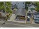 Aerial view of the cozy coastal home with detached garage, golf cart, and an inviting front porch at 6001 - 1308 S Kings Hwy., Myrtle Beach, SC 29575