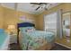 Charming bedroom with flamingo bedding and a ceiling fan at 6001 - 1308 S Kings Hwy., Myrtle Beach, SC 29575