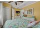 Inviting bedroom featuring bright walls, coastal decor, and a comfortable bed with a colorful flamingo-themed quilt at 6001 - 1308 S Kings Hwy., Myrtle Beach, SC 29575