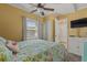 Yellow bedroom features a flamingo themed bed and a flat screen television at 6001 - 1308 S Kings Hwy., Myrtle Beach, SC 29575