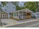 Charming coastal home with a cozy front porch, vibrant exterior, well-kept yard, and convenient parking at 6001 - 1308 S Kings Hwy., Myrtle Beach, SC 29575