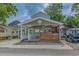 Inviting single-story beach house with a charming front porch, appealing architectural details, and a cozy ambiance at 6001 - 1308 S Kings Hwy., Myrtle Beach, SC 29575