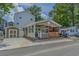 Charming single-story home with a cozy front porch, quaint architectural details, and a detached garage at 6001 - 1308 S Kings Hwy., Myrtle Beach, SC 29575