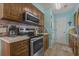 Bright kitchen with stainless steel appliances and a tiled backsplash at 6001 - 1308 S Kings Hwy., Myrtle Beach, SC 29575
