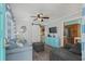 Charming living room featuring a stylish blue sofa, comfortable seating, and seamless flow to the kitchen at 6001 - 1308 S Kings Hwy., Myrtle Beach, SC 29575