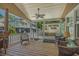 Relaxing outdoor porch with comfortable wicker seating, a ceiling fan, and serene views of the neighborhood at 6001 - 1308 S Kings Hwy., Myrtle Beach, SC 29575