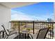 Balcony area with multiple chairs and a table with an excellent view of the beach and surrounding area at 601 Mitchell Dr. # 808, Myrtle Beach, SC 29577