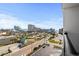 View from balcony of the beach and surrounding city on a sunny day with a blue sky and scattered clouds at 601 Mitchell Dr. # 808, Myrtle Beach, SC 29577