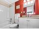 This bathroom features a single sink, granite countertop, white cabinets, and a shower and tub combo at 601 Mitchell Dr. # 808, Myrtle Beach, SC 29577