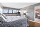 Bedroom with wood floors features a king size bed and bright windows at 601 Mitchell Dr. # 808, Myrtle Beach, SC 29577