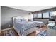 Cozy bedroom with two beds, wood floors, and bright natural light from the window at 601 Mitchell Dr. # 808, Myrtle Beach, SC 29577